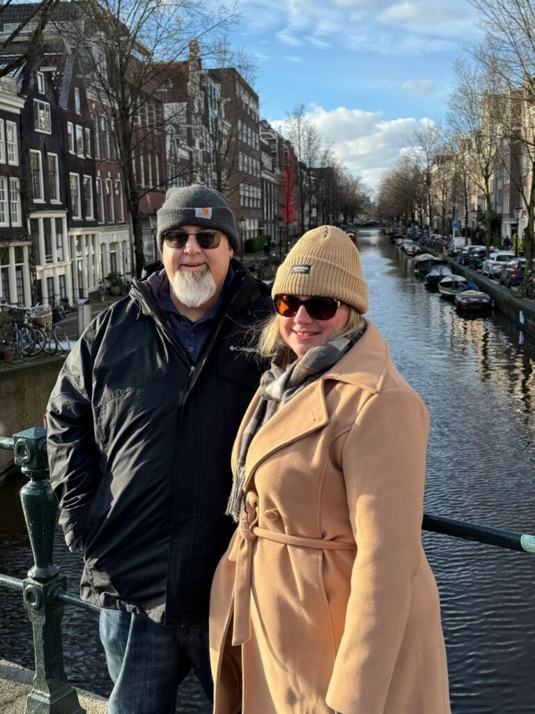 Ken and Laura in front of a canal in the Jordaan