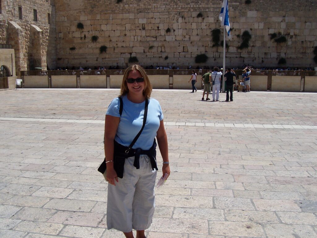 Laura in front of Israel's Wailing Wall