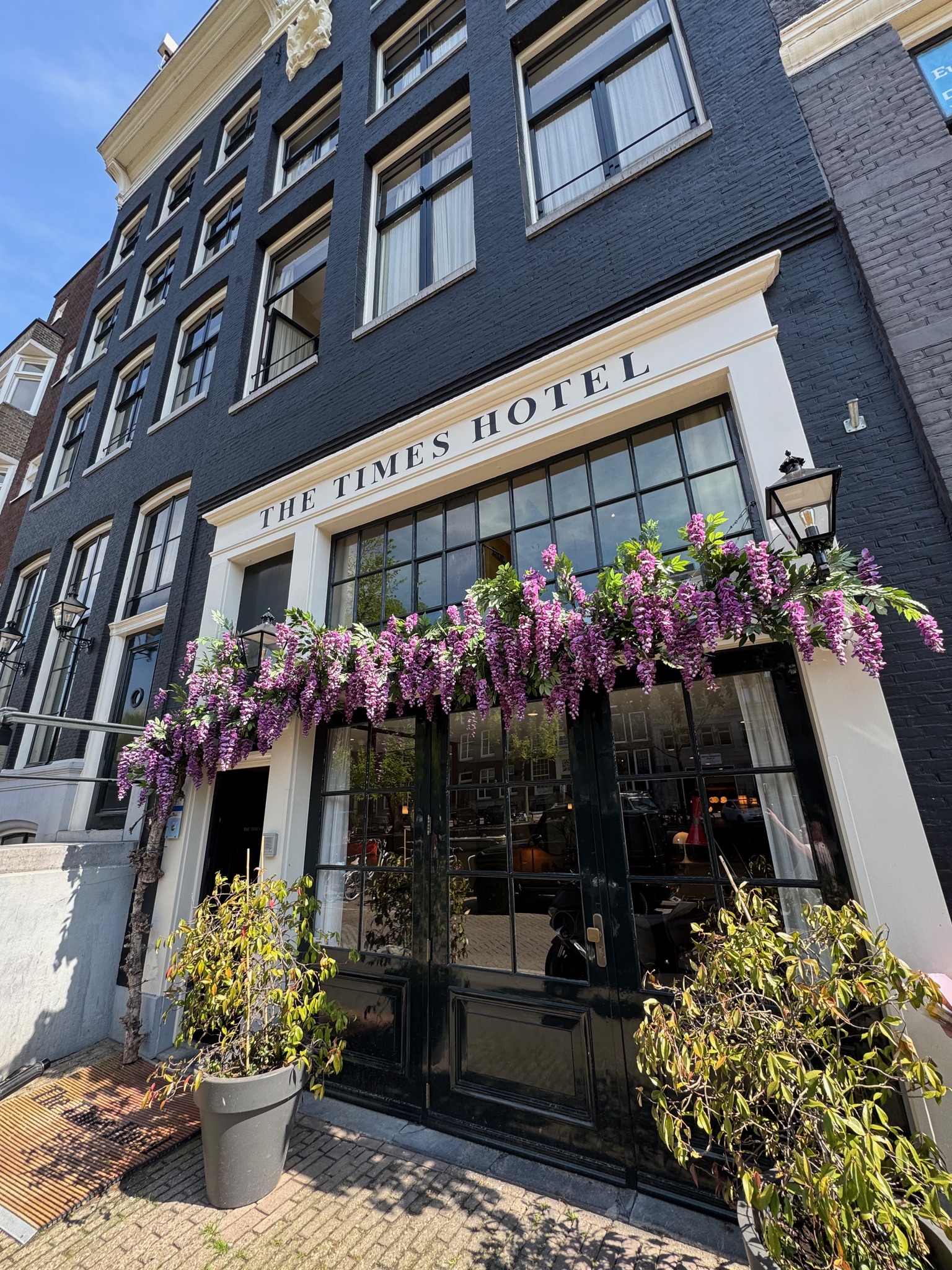 The Times Hotel with their signature purple flowers
